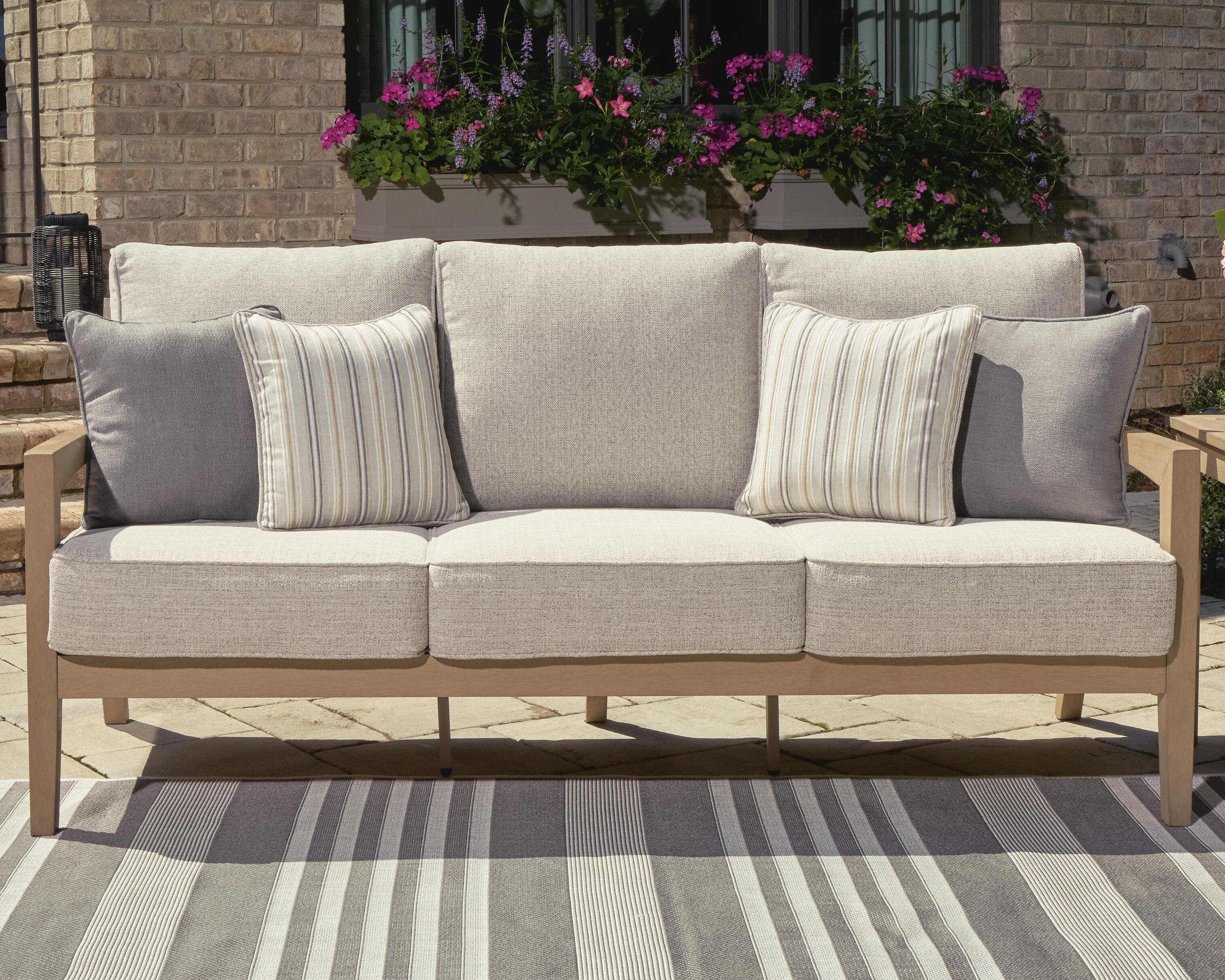 Hallow Creek Outdoor Sofa with Cushion — Brown/Beige — view 2